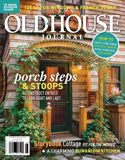 Old House Journal cover shot of front entrance with an archway and plants.