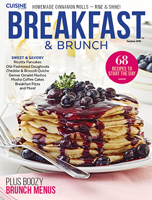 Cuisine Breakfast & Brunch magazine cover shot of stack of pancakes with blueberry sauce.